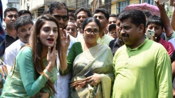 Nusrat Jahan, TMC Candidate, Greeted by Scores of Fans With Selfie Request; Stage Collapses Nusrat Jahan, TMC Candidate, Greeted by Scores of Fans With Selfie Request; Stage Collapses