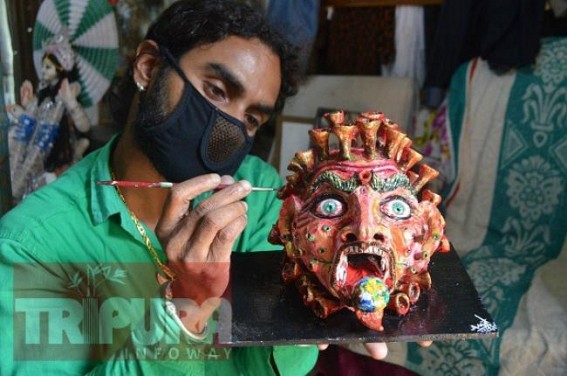 Agartala man makes COVID19â€™s monster face swallowing earth