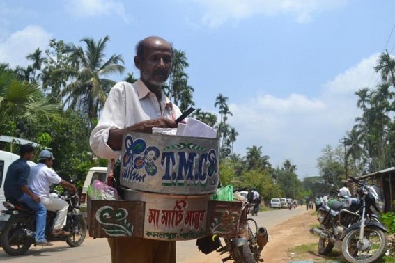 Kamalpur : A Hawker with Trinamul banner selling snacks. TIWN Pic May 22