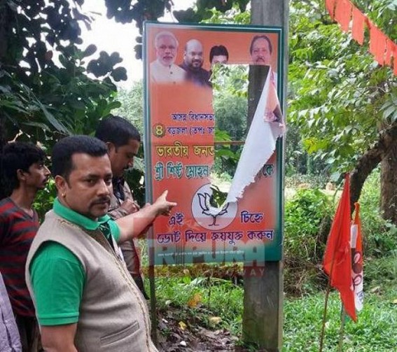 Flags festoons of BJP destroyed, triggers resentment Flags festoons of BJP destroyed, triggers resentment
