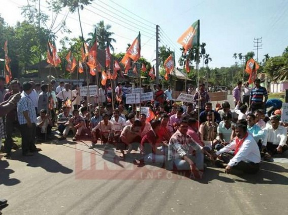 BJP supporters blocked road, targeted Left front Govt. for attacking their party supporters BJP supporters blocked road, targeted Left front Govt. for attacking their party supporters