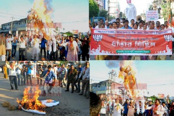 BJP led mass-protests  flood Agartala Streets,burnt effigies, labels Tripura CM a TRAITOR, Anti-National,agent of Pakistan, China : Communist Manikâ€™s face loss continues for insulting India, BJP burnt effigy, branded CPI-M leader as Nationâ€™s Enemy