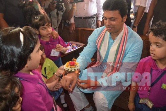 Children tie rakhi to CM Biplab Deb