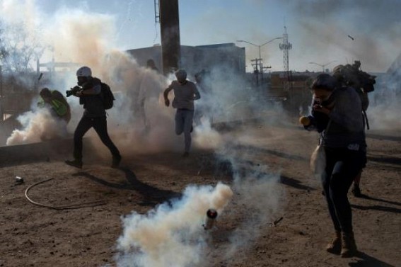 US fires tear gas at Mexico border to deter migrants US fires tear gas at Mexico border to deter migrants