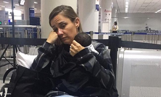 US woman held in Manila for hiding baby in luggage US woman held in Manila for hiding baby in luggage