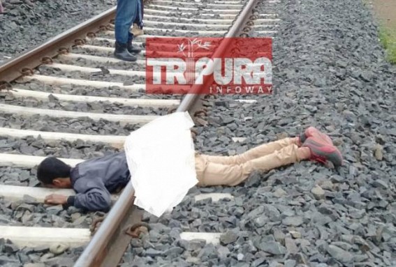 Youth's body found cut into two pieces on railway track Youth's body found cut into two pieces on railway track