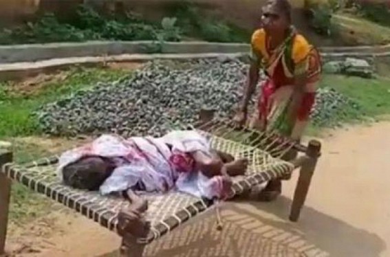 70-yr-old woman drags mother on cot to bank 70-yr-old woman drags mother on cot to bank