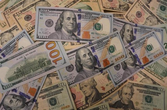 US dollar dips as risk-off mood eases
