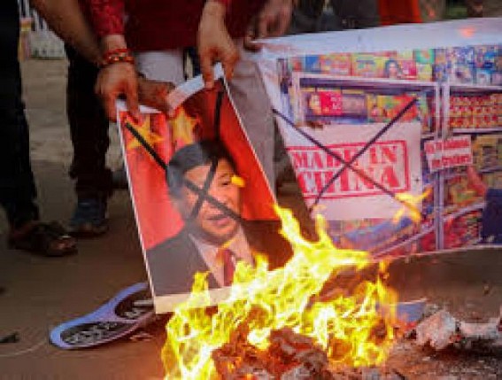 Protesting BJP youth workers burn Chinese flag in Goa