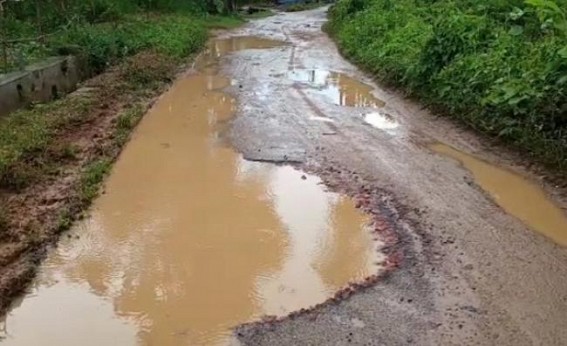 Road became a 'mini-pond' in Teliamura, creating huge problems for vehicle movement Road became a 'mini-pond' in Teliamura, creating huge problems for vehicle movement