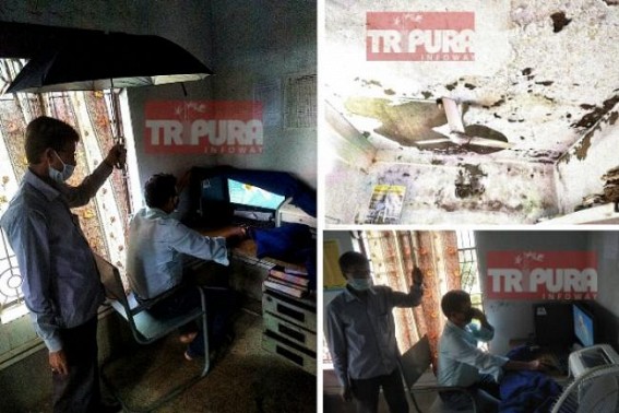 BJP HIRA's 28 months rule in Tripura, 'Ek Tripura, Srestha(?) Tripura' : State Govt office employees work with umbrella inside office to save themselves from rain showered Office in Jolaibari, Tripura's worst era in State's history