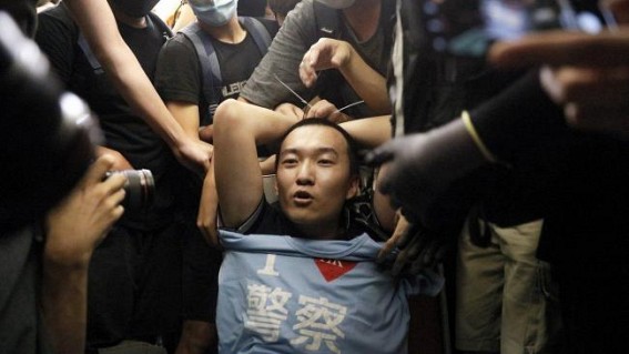 3 in Hong Kong convicted over assaulting journalist