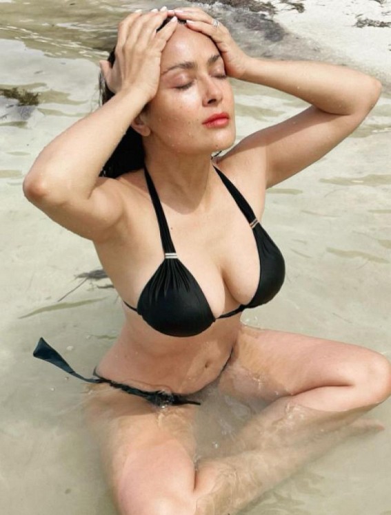Salma Hayek slays it in black bikini