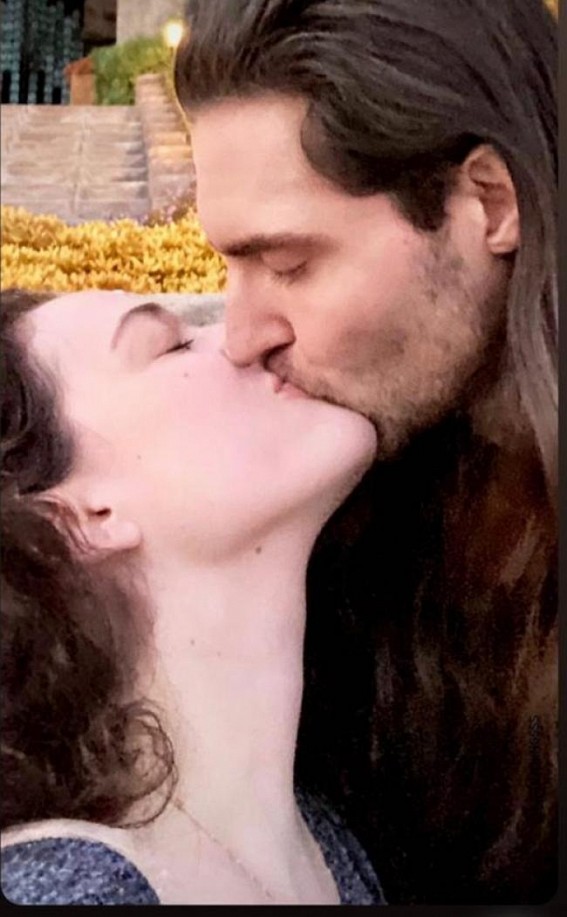 Kat Dennings, Andrew WK share a passionate kiss in new pic