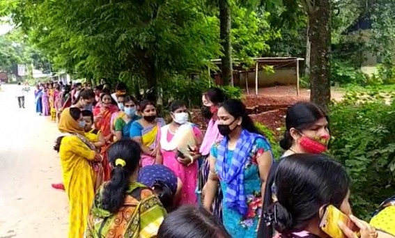 No Social Distancing in Covid Vaccination Centres : Public standing in long rows under the Sky amid Rainy Weather 