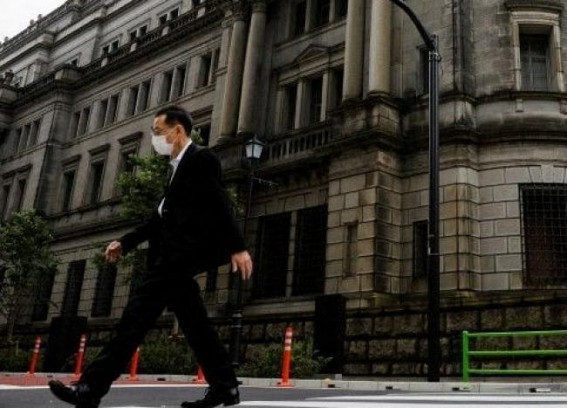 Bank of Japan raises inflation outlook