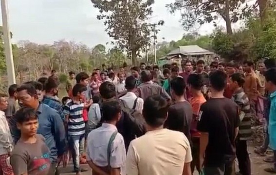 Locals in Ganganagar Bazar at Gandachara- Ambassa blocked road raising demand for road repairs and pure drinking water 
