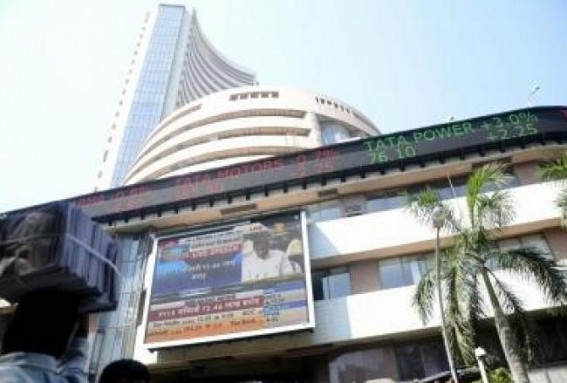 Equity indices settle marginally low amid volatile trade