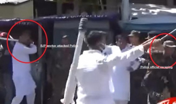 Viral Video shows, BJP worker chasing Tripura Police with Stick Viral Video shows, BJP worker chasing Tripura Police with Stick