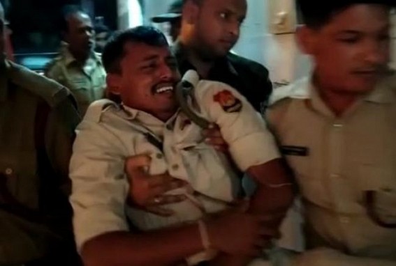 Two on-duty Police officials were injured after a Maruti Vehicle hit them in Bishalgarh